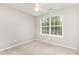 This bedroom has a sun-filled window and neutral colored walls at 230 Dawn Mist Ln, Fort Mill, SC 29708
