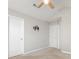 Neutral bedroom with a ceiling fan, two doors, and a wall mount for a TV at 230 Dawn Mist Ln, Fort Mill, SC 29708