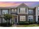 Charming townhome exterior with stone accents, tidy landscaping, and a welcoming entrance at 230 Dawn Mist Ln, Fort Mill, SC 29708