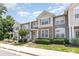 Inviting townhome community showcasing well-maintained landscaping and charming exteriors under a bright sky at 230 Dawn Mist Ln, Fort Mill, SC 29708