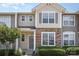 Charming townhome exterior with stone accents, tidy landscaping, and a welcoming entrance at 230 Dawn Mist Ln, Fort Mill, SC 29708