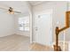 Bright entryway with wood-look floors, an arched doorway, and stairs with wooden railings at 230 Dawn Mist Ln, Fort Mill, SC 29708