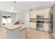 Kitchen offering a view of the sink and faucet, stainless steel oven and microwave, and wooden cabinets at 230 Dawn Mist Ln, Fort Mill, SC 29708