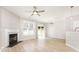Spacious living room featuring a fireplace, wood-look floors, and sliding door access to the outdoors at 230 Dawn Mist Ln, Fort Mill, SC 29708