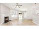 Spacious living room featuring a fireplace, wood-look floors, and sliding door access to the outdoors at 230 Dawn Mist Ln, Fort Mill, SC 29708