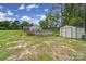 Spacious backyard featuring an above ground pool, storage shed and lush greenery at 2302 Douglas Rd, Lancaster, SC 29720