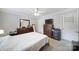 Cozy bedroom featuring a neutral color scheme, dresser, and carpeting at 2302 Douglas Rd, Lancaster, SC 29720