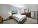 Neutral bedroom with a bed, dressers, ceiling fan, and a window at 2302 Douglas Rd, Lancaster, SC 29720