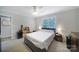 Inviting bedroom with a ceiling fan, carpet, and dresser at 2302 Douglas Rd, Lancaster, SC 29720