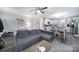 Inviting open-concept living space with hardwood floors that flows into a bright kitchen and dining area at 2302 Douglas Rd, Lancaster, SC 29720