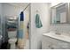 Clean bathroom with a vanity, mirror, and tiled shower at 238 N Depot St, Albemarle, NC 28001