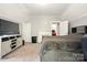 Spacious carpeted bedroom features modern gray walls and a view of the chimney at 238 N Depot St, Albemarle, NC 28001