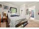 Bedroom with carpeted floor, natural light, and adjacent bathroom entrance at 238 N Depot St, Albemarle, NC 28001