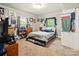 Bright bedroom with carpeted floors, light gray walls, and built in shelving at 238 N Depot St, Albemarle, NC 28001