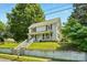 Charming two-story home with a welcoming front porch and well-maintained lawn on a sunny day at 238 N Depot St, Albemarle, NC 28001