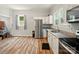 Spacious kitchen with stainless steel appliances, granite countertops, and plenty of natural light at 238 N Depot St, Albemarle, NC 28001