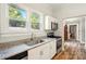 Well-lit kitchen with stainless steel appliances and granite countertops at 238 N Depot St, Albemarle, NC 28001
