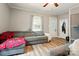 Inviting living room with a comfortable gray sofa and a view of the front door at 238 N Depot St, Albemarle, NC 28001