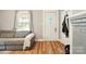 Bright living room with hardwood floors, and a view of the front door at 238 N Depot St, Albemarle, NC 28001