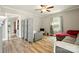 Cozy living room featuring a ceiling fan and plenty of natural light at 238 N Depot St, Albemarle, NC 28001