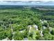 Wide aerial view of the neighborhood, featuring lush trees and green spaces, providing a sense of peaceful living at 240 Hillcrest Dr, Harrisburg, NC 28075