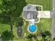 Aerial view of property featuring a backyard pool, patio, and landscaped yard at 240 Hillcrest Dr, Harrisburg, NC 28075