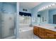 Bathroom with jacuzzi tub, shower, and double sink vanity at 240 Hillcrest Dr, Harrisburg, NC 28075