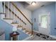 Welcoming foyer with stairs and light blue walls at 240 Hillcrest Dr, Harrisburg, NC 28075