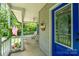 View of a covered front porch with rocking chairs and an American flag, offering a cozy outdoor space at 240 Hillcrest Dr, Harrisburg, NC 28075