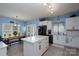 Spacious kitchen with center island, stainless steel appliances, and ample cabinet space at 240 Hillcrest Dr, Harrisburg, NC 28075