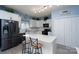 Bright kitchen featuring white cabinets, a center island, and modern appliances at 240 Hillcrest Dr, Harrisburg, NC 28075
