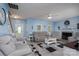 Cozy living room with fireplace, plush seating, and large windows providing natural light at 240 Hillcrest Dr, Harrisburg, NC 28075