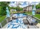 Relaxing poolside deck with stylish outdoor furniture, providing an ideal spot for leisure and entertainment at 240 Hillcrest Dr, Harrisburg, NC 28075