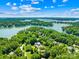 Breathtaking aerial view of lakefront homes nestled amongst lush greenery, showcasing a serene and picturesque community at 266 Riverwood Rd, Mooresville, NC 28117