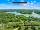 Aerial view showcases a home's proximity to a lake and the downtown area, a short 14-minute drive away at 266 Riverwood Rd, Mooresville, NC 28117