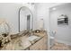 Bathroom featuring a granite countertop vanity with a unique mirror, providing a stylish and functional space at 266 Riverwood Rd, Mooresville, NC 28117