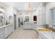 Bright bathroom featuring a soaking tub, custom cabinetry, and ample counter space at 266 Riverwood Rd, Mooresville, NC 28117