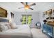 Bright bedroom with a large window, neutral carpet, and ceiling fan providing a relaxing space with ample natural light at 266 Riverwood Rd, Mooresville, NC 28117