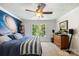 Stylish bedroom with a queen bed, ceiling fan, and a decorative galaxy wall mural, creating a unique and cozy space at 266 Riverwood Rd, Mooresville, NC 28117