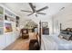 Bedroom with a decorative rug, four-poster bed, ceiling fan, and built-in shelving for a functional and stylish space at 266 Riverwood Rd, Mooresville, NC 28117