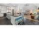 Gourmet kitchen showcasing center island with seating, modern fixtures, and an open concept layout at 266 Riverwood Rd, Mooresville, NC 28117