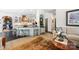 Open-concept kitchen featuring a breakfast bar, modern appliances, and stylish decor in a well-lit space at 266 Riverwood Rd, Mooresville, NC 28117
