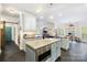 Open kitchen featuring custom island, bar seating, stainless appliances, and ample counter space at 266 Riverwood Rd, Mooresville, NC 28117