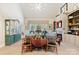 Bright living room featuring a vaulted ceiling, hardwood floors, and a cozy fireplace, perfect for gatherings at 266 Riverwood Rd, Mooresville, NC 28117