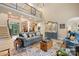 Cozy living room with a classic sofa, a decorative cabinet, and a view of the entry at 266 Riverwood Rd, Mooresville, NC 28117