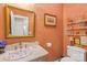 Charming powder room featuring unique fixtures, stylish decor, and a well-lit vanity area at 266 Riverwood Rd, Mooresville, NC 28117