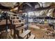 Unfinished basement with stairs, brick walls, ductwork, exposed beams and HVAC system at 310 S Spencer Ave, Spencer, NC 28159