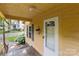 Charming front porch with blue hydrangea bushes, white door and gray railings at 310 S Spencer Ave, Spencer, NC 28159