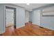 Bright hallway features hardwood floors, pale blue walls and white trim at 310 S Spencer Ave, Spencer, NC 28159