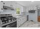 Kitchen with stainless steel appliances and white cabinets at 310 S Spencer Ave, Spencer, NC 28159